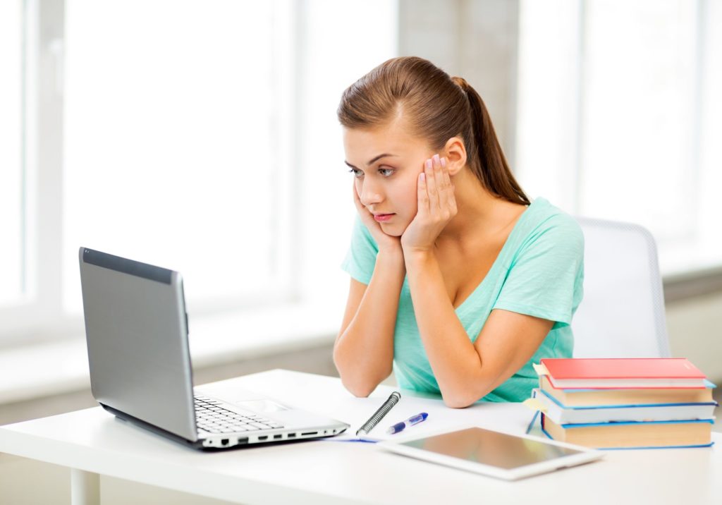 Student sitting at desk, distance learning