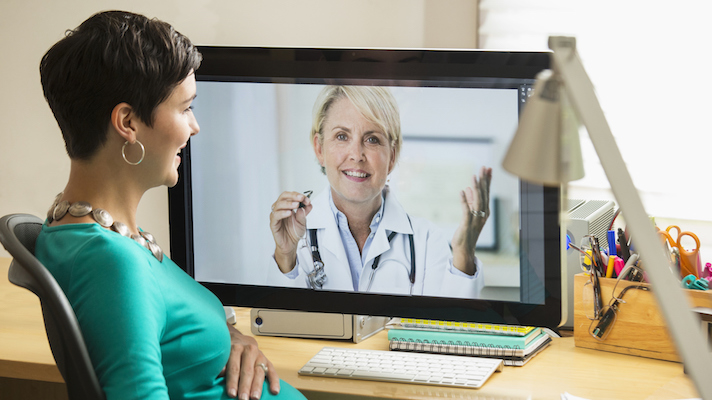 Woman on an e-visit with telemedicine provider